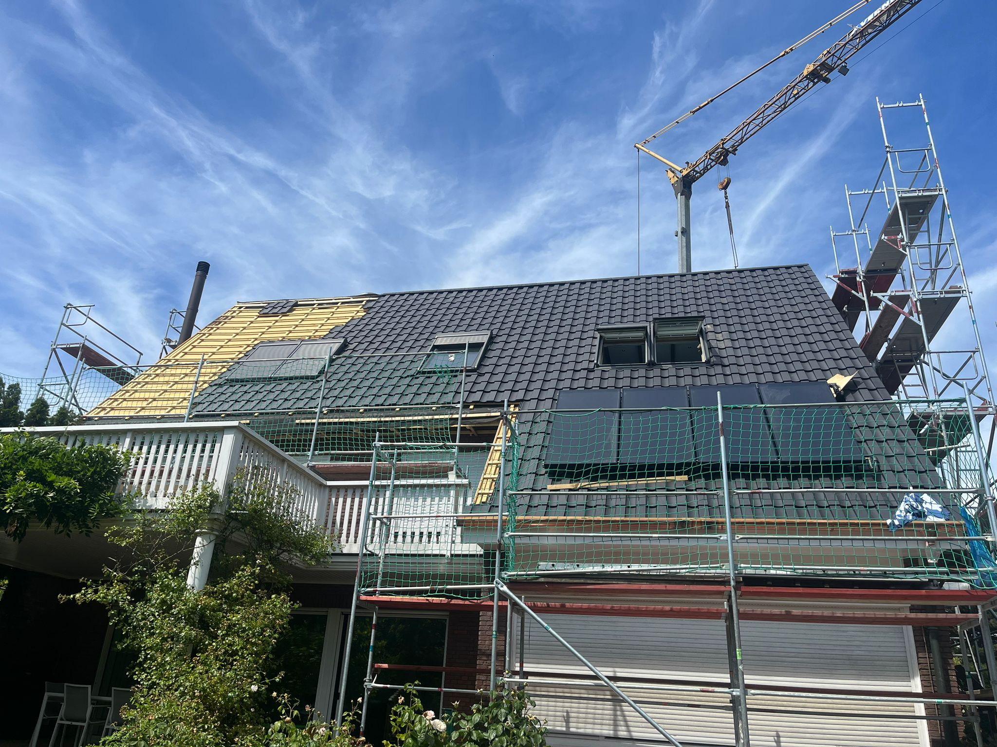 Dachsanierung, Aufsparrendämmung, Dachziegel, Dachfenster